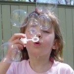 Girl blowing bubbles