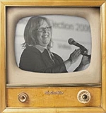 Elizabeth May on an old television