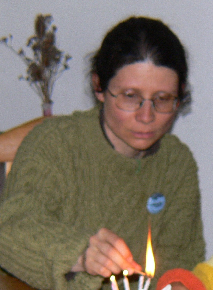 Adriana Mugnatto-Hamu lighting a candle