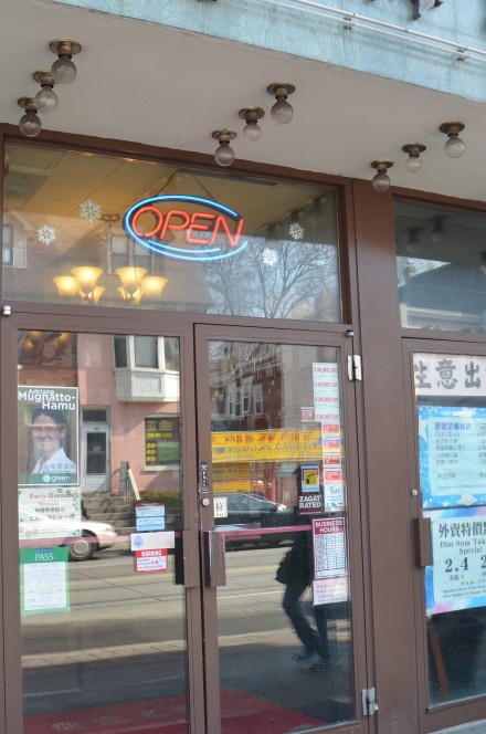 Toronto-Danforth candidate's campaign poster in Chinatown East window